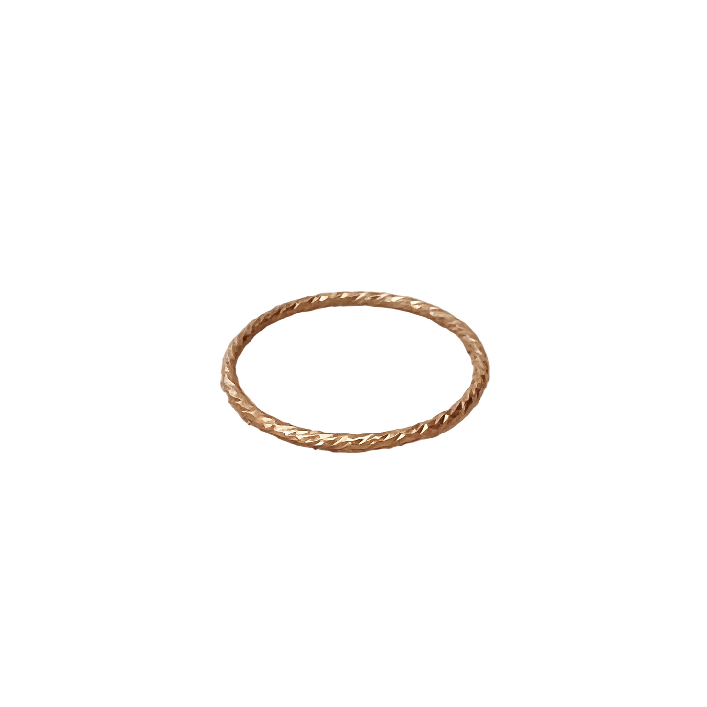 Gold ring on a beige fabric background