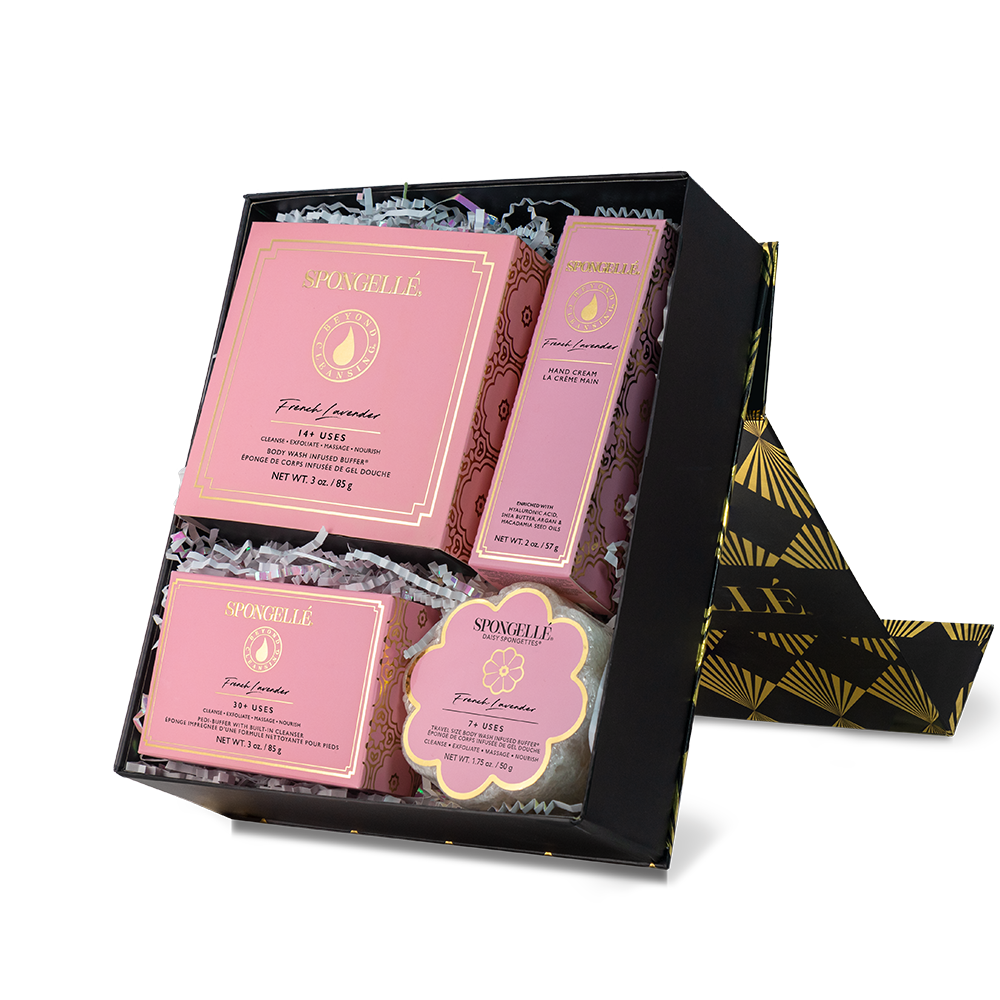 Spa gift set with pink packaging and gold accents on a white background