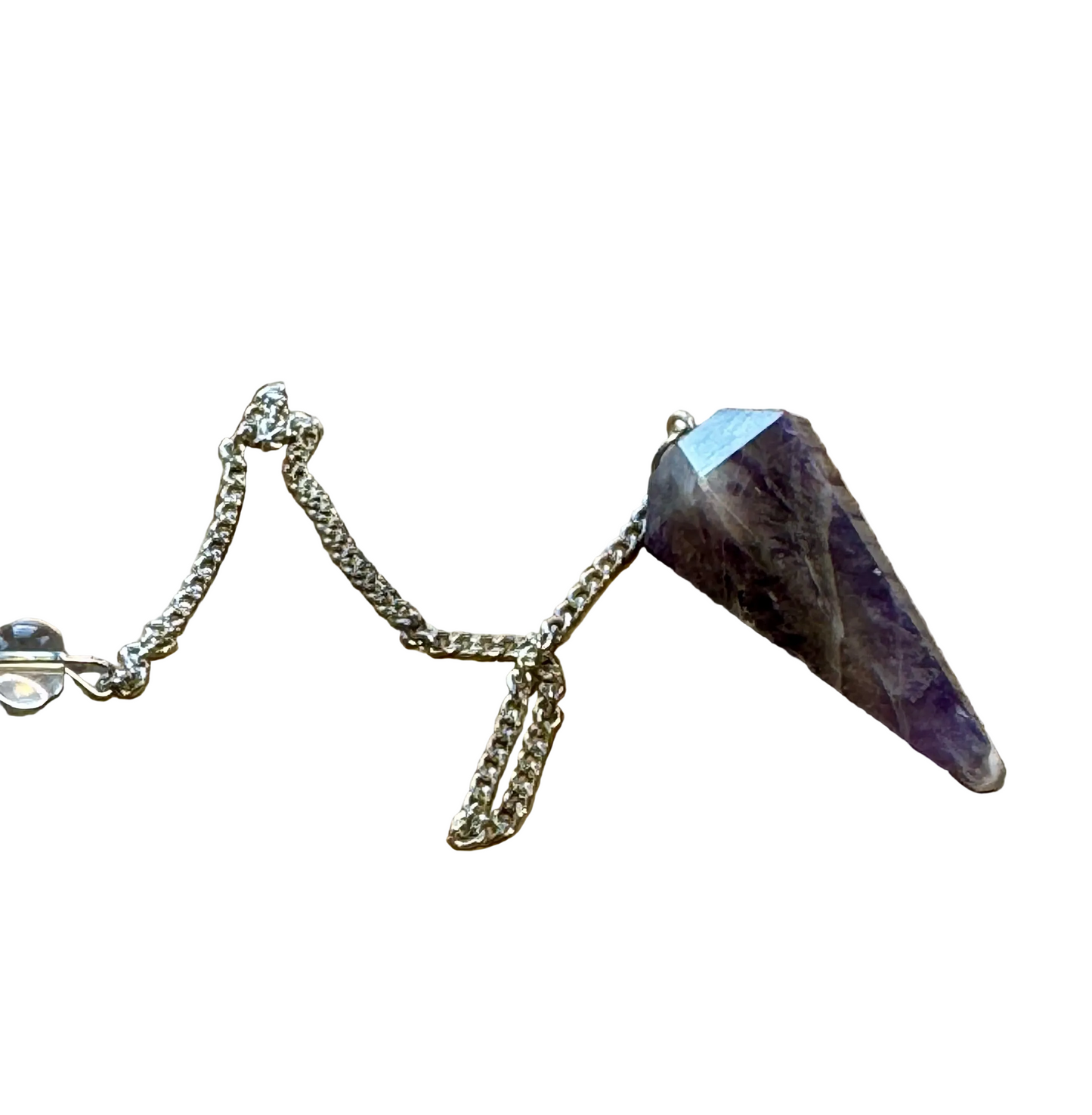 Amethyst crystal pendulum on a wooden surface