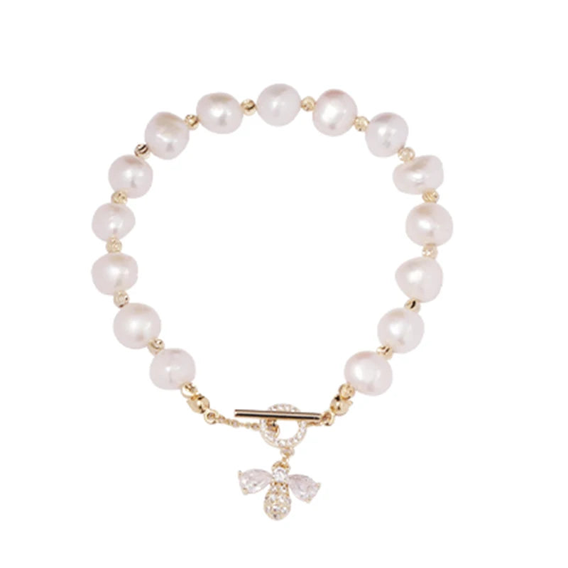Pearl bracelet with a gold clasp on a white background
