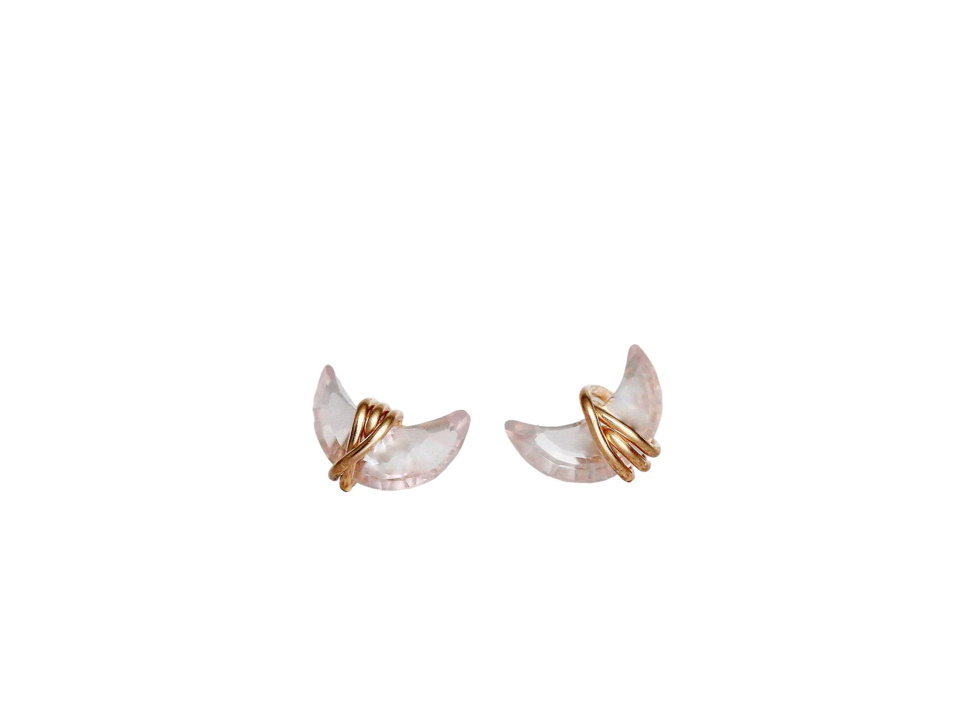 Pair of gold and pearl earrings on a white background