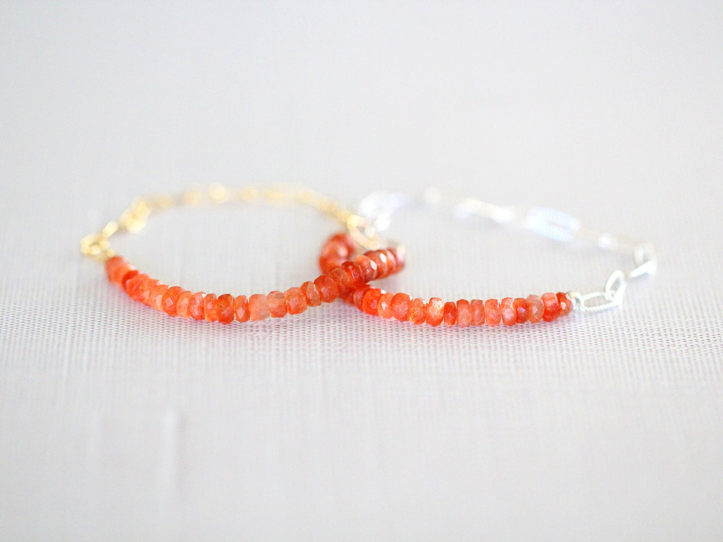 Bracelet with red beads on a white background