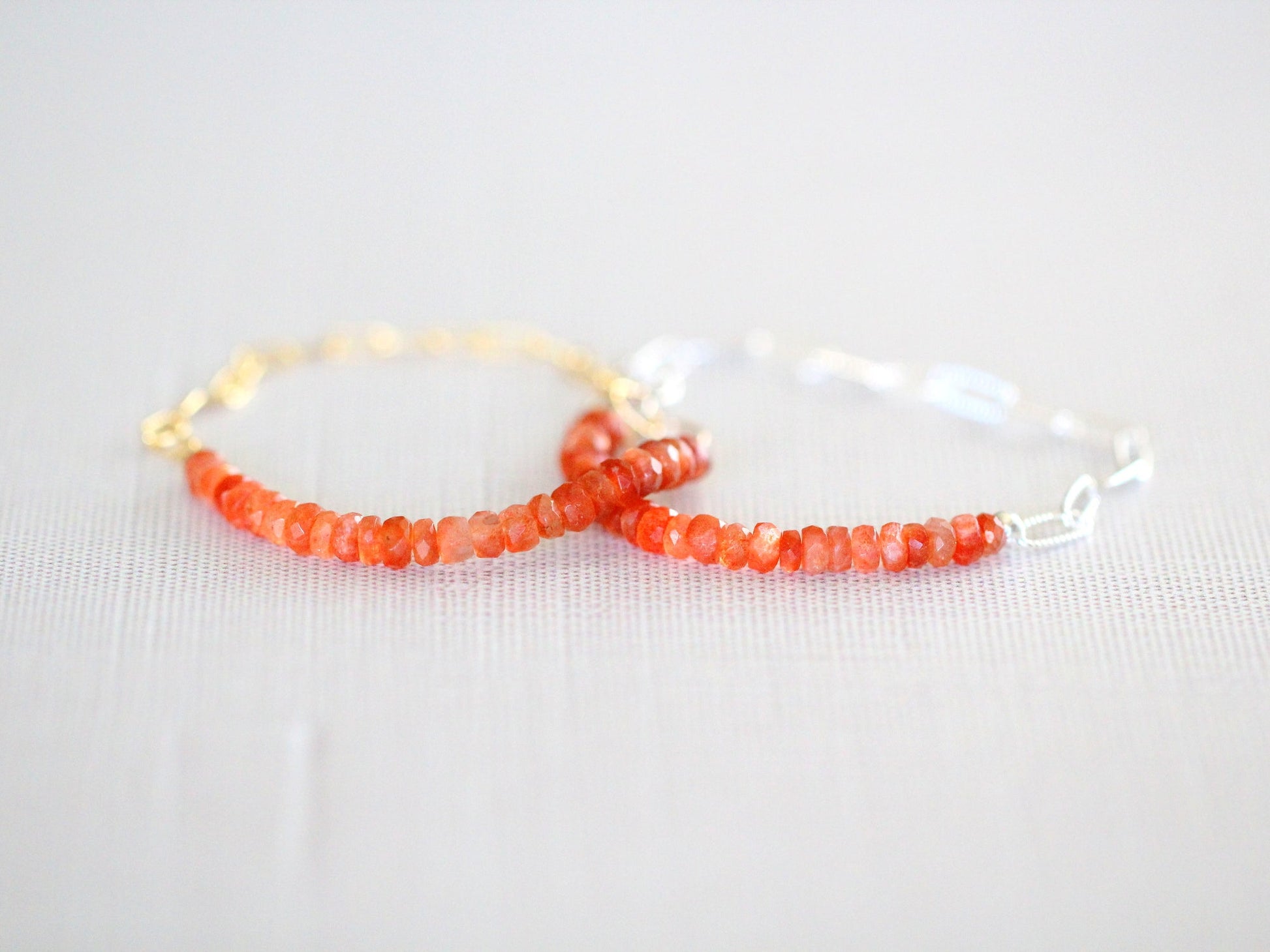Bracelet with red beads on a white background