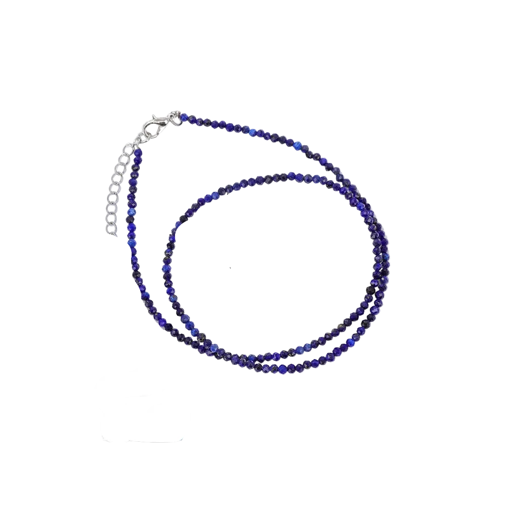 Lapis Lazuli necklace on a card with information about the stone and its properties.