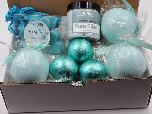 Box of bath bombs and a jar labeled 'Pure Bliss' with 'Spa Pure' branding.