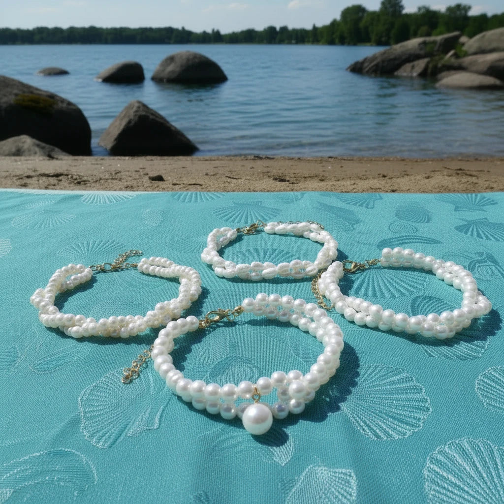Set of pearl bracelets on a black background