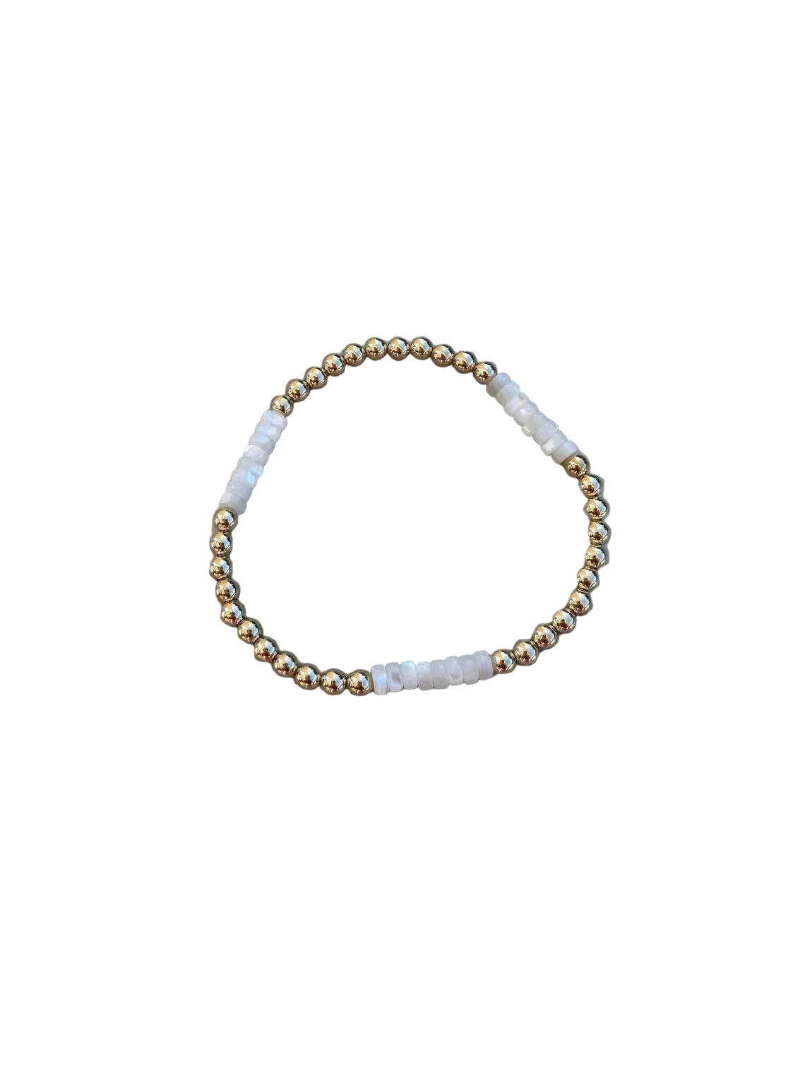 Beaded bracelet with gold and white beads on a marble surface