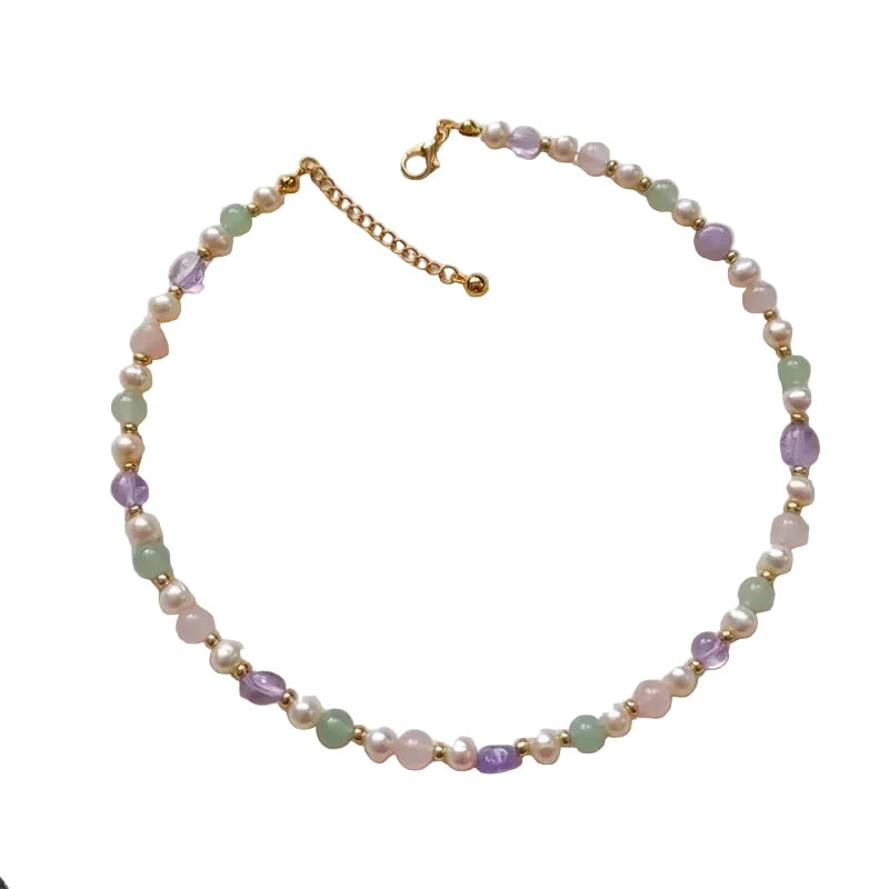 Necklace with pastel-colored beads on a white background