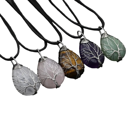 Set of five stone pendants with leaf patterns on a white background